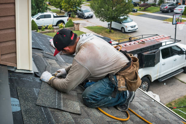 Professional Roofing technician working in Manson, WA